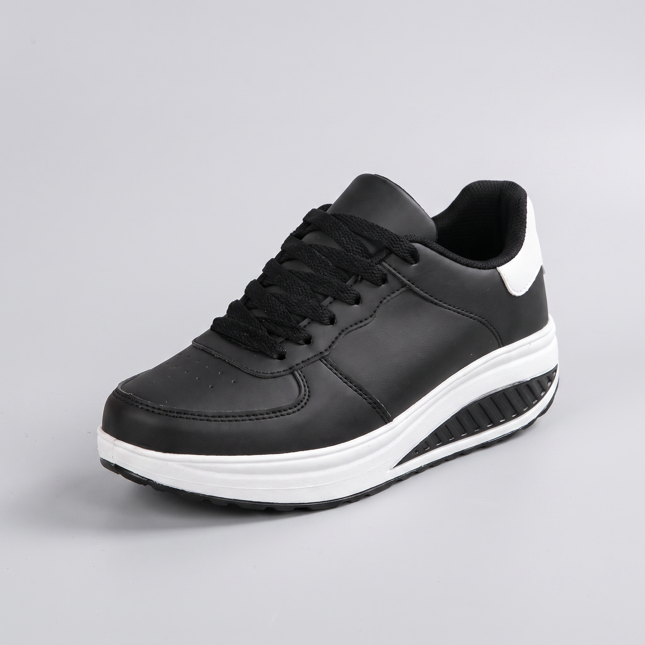 Chloe | Platform Sneakers with a Curved Sole Black and White, photo studio
