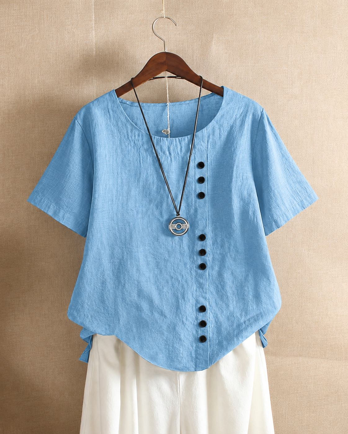 Ursula | Asymmetric Button Blouse Light Blue, studio photo