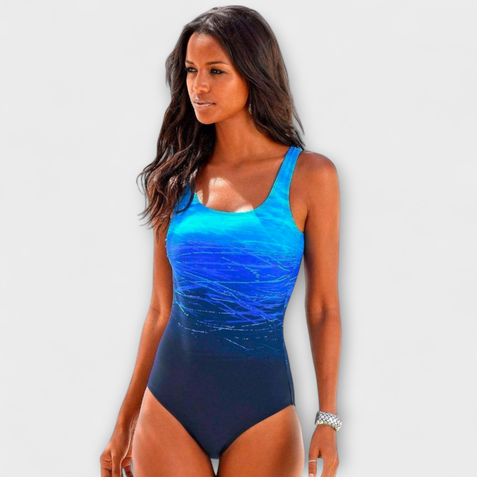 Sporty One-Piece Swimsuit in Coral Sunset Ombre Blue, photo studio