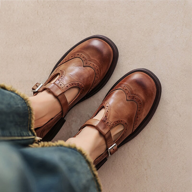 Perforated Wingtip Leather Mary Janes Brown, studio photo