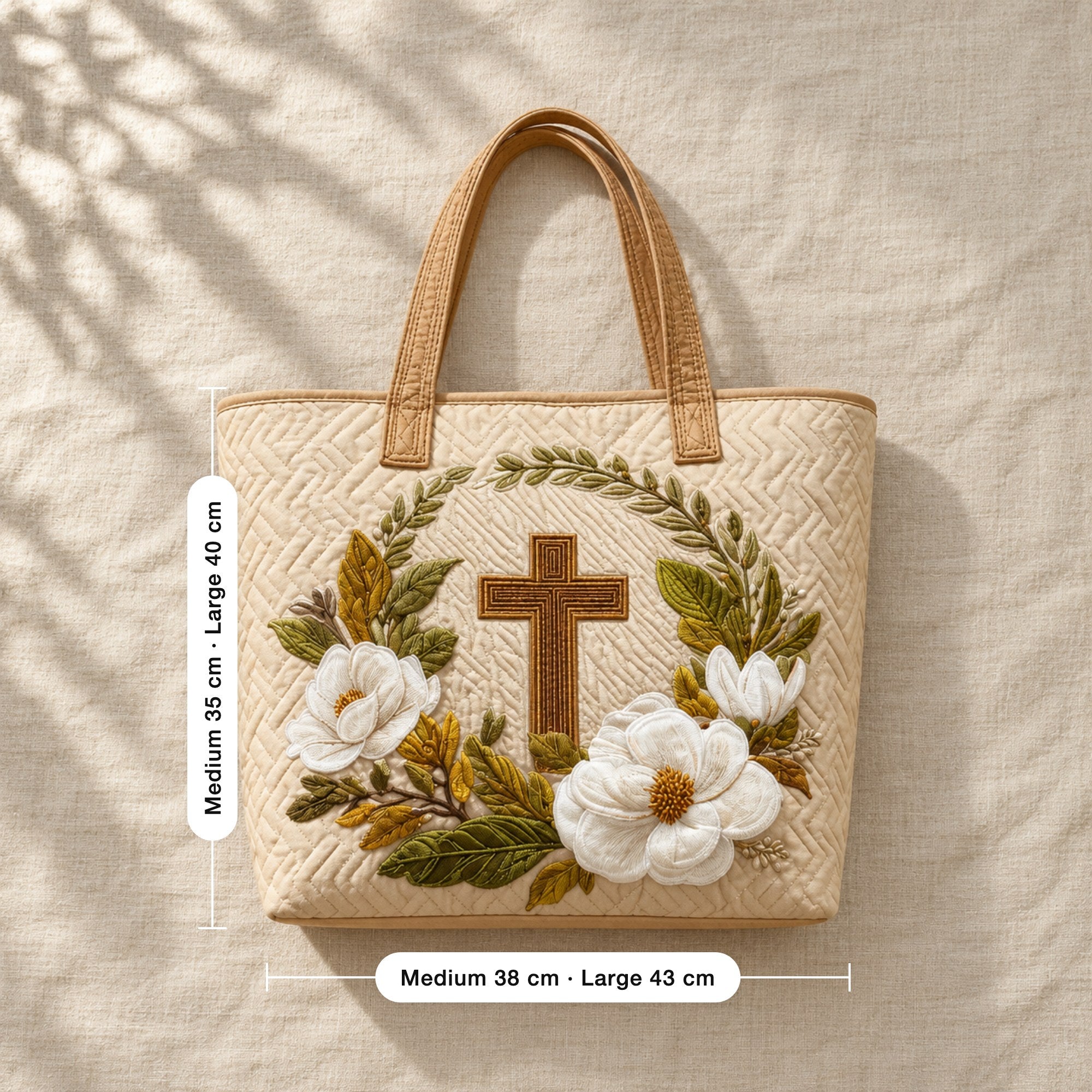 Maudie | Quilted Tote Bag with a Cross and Magnolias, flat lay with sizes